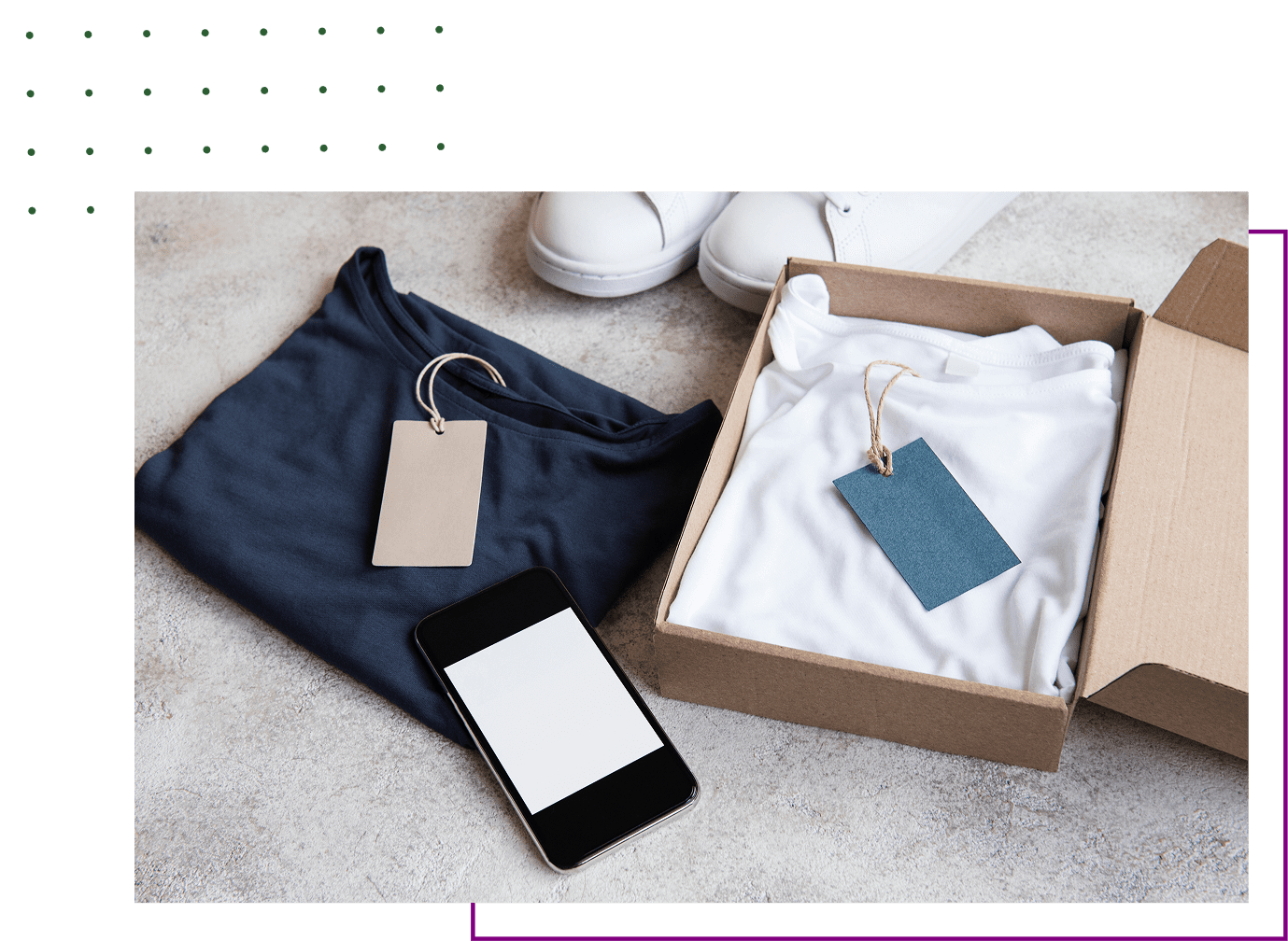 Boxed white shirt beside black phone