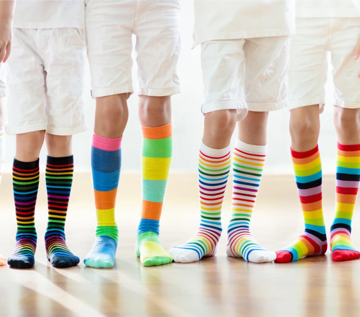 Colorful striped socks on children's legs
