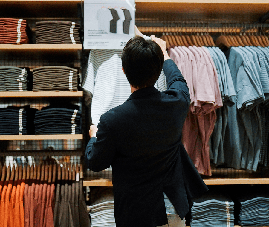 Customer browsing clothing rack
